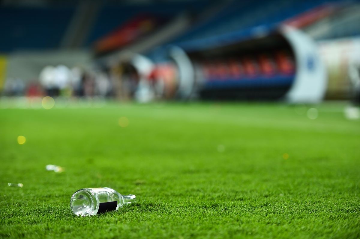 Plastic trash can on the turf on a soccer field